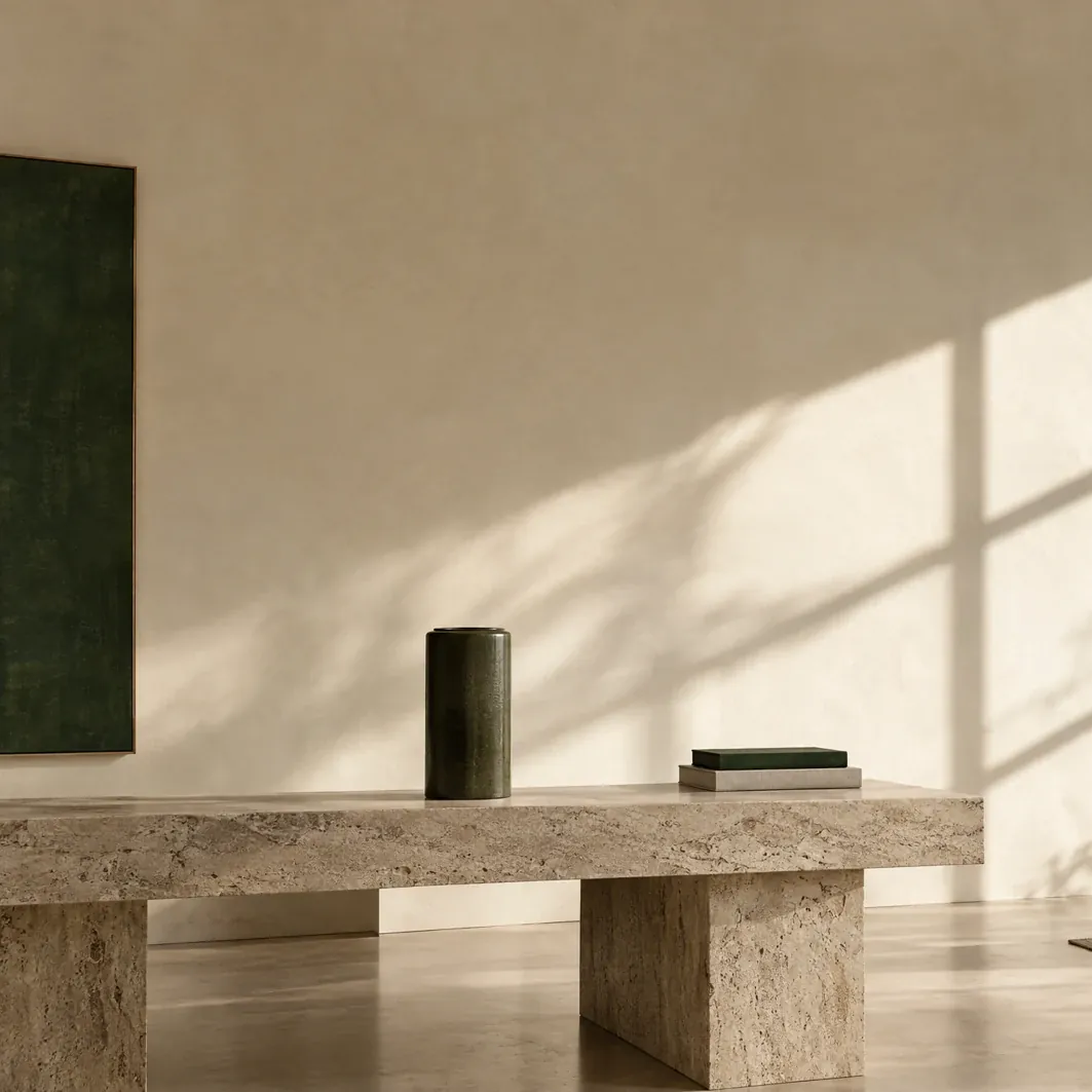 The same dark green vessel standing empty on the bench